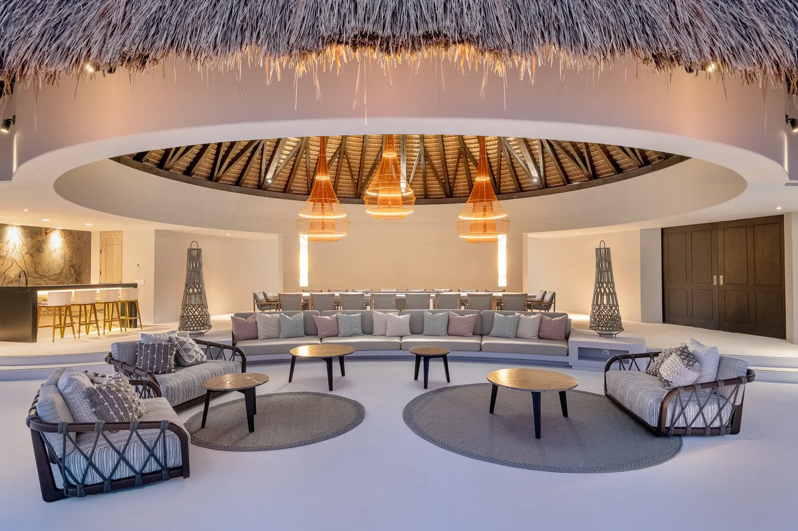 The palapa lounge at Casa Akai lit at night, ready for a celebration