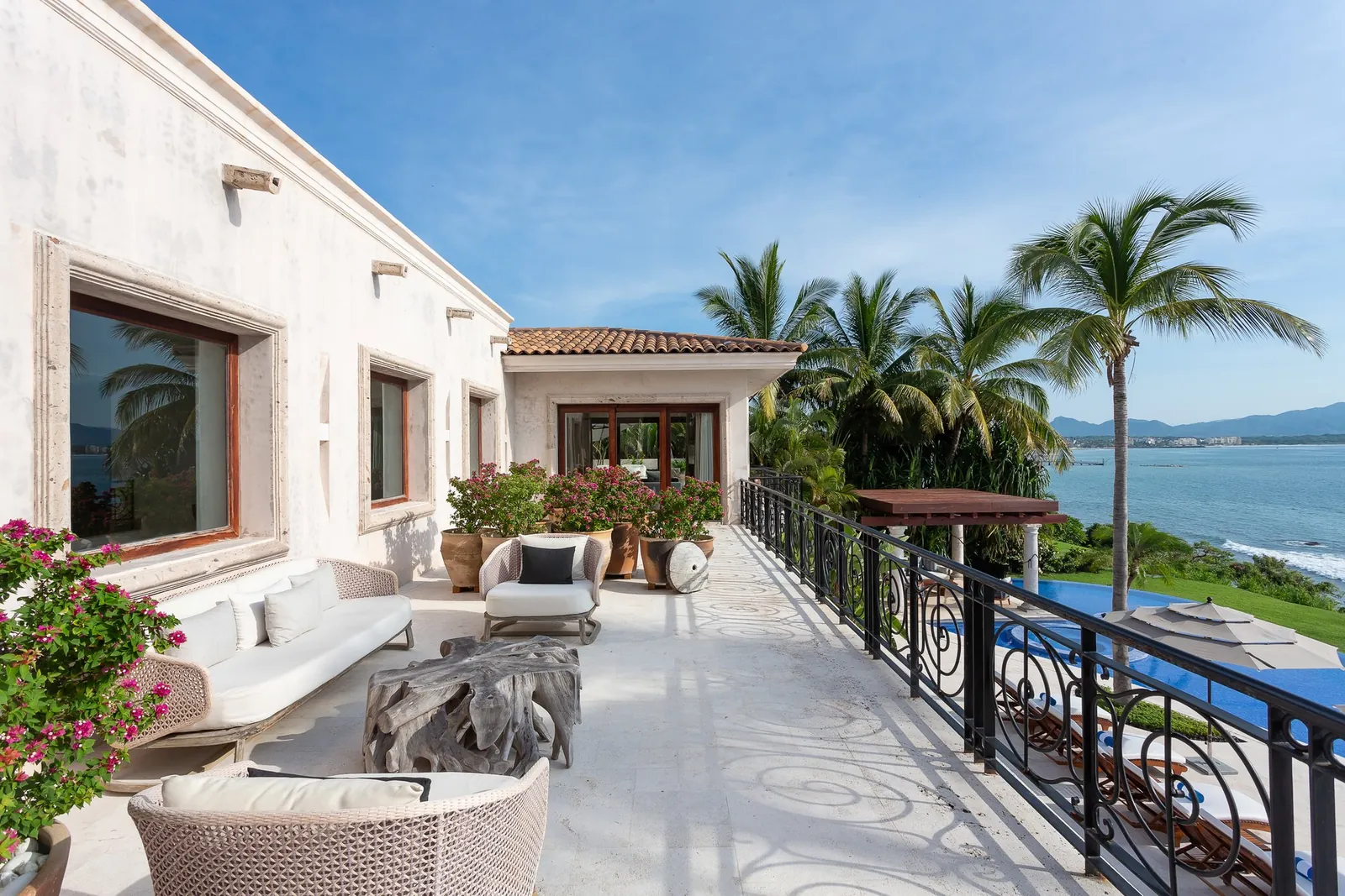 The upper terrace at Casa La Vida, bougainvillea and the ocean beyond