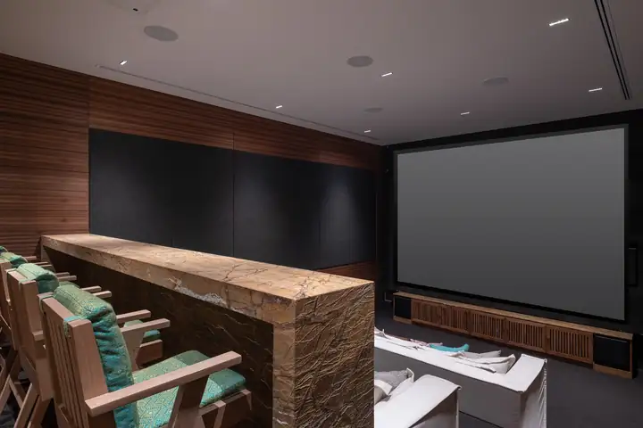 The private cinema at Casa Akai, tiered sofas for a group movie night or a presentation