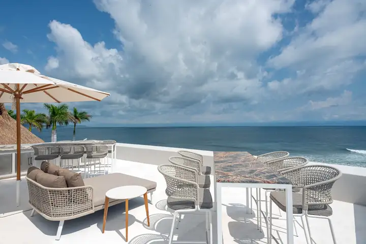 Lounge chairs on Casa Akai's roof terrace above the bay