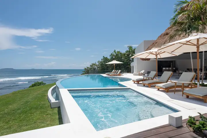 Casa Akai's two heated pools above the ocean, one shallow enough for children