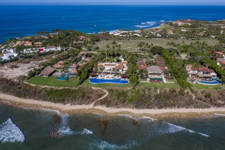 La Punta Estates from the air: Casa La Vida's long pool above the reef, oceanfront villas along the point